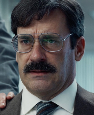 Jon Hamm wears a pair of steel aviator eyeglasses in the 2023 movie Corner Office.