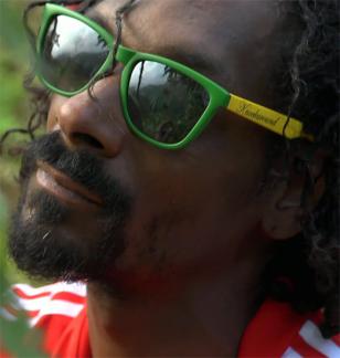 Snoop Lion (aka Snoop Dogg) wearing Knockaround Rasta premium sunglasses