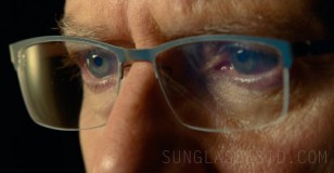 Campbell Scott wears rectangle metal eyeglasses in Jurassic World: Dominion.