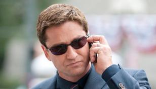 Gerard Butler wears Oakley C-Wire sunglasses in the film Olympus Has Fallen