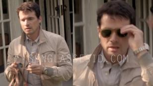 Matthew Settle wearing light havana Persol 0714 folding sunglasses and a Rolex w