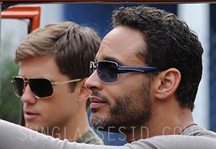 Daniel Sunjata wears a pair of blue Prada PS 53NS sunglasses in Graceland