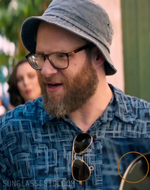 Randolph Engineering Concorde aviator sunglasses hanging on the shirt of Seth Rogen in the film Long Shot.