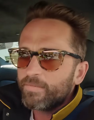 Stunt man Logan Holladay wears Ray-Ban Wayfarer II Classic sunglasses in the The Fall Guy 'Carpool' marketing video.