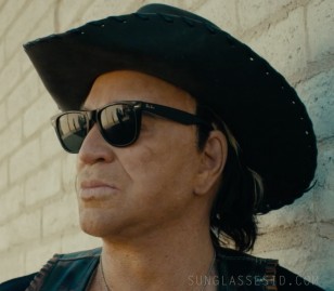 Mickey Rourke wears Ray-Ban Wayfarer sunglasses in The Commando.