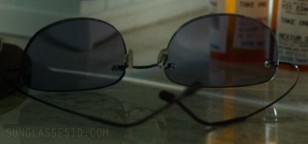 Close up of the light weight rimless sunglasses with flexible hingeless arms in The Last Movie Star.