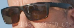 Enhanced image of the sunglasses worn by Ed Helms in Corporate Animals