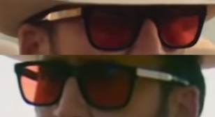 The Police sunglasses worn by Nicolas Cage have a black and gold frame and custom red lenses.