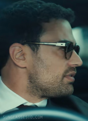 The diamond shape of Theo James' sunglasses can be seen well in this image.