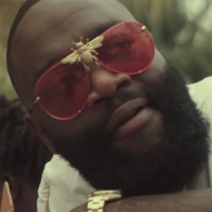Rick Ross wears Tnemnroda I'll Be Rich Forever sunglasses in the music video for Monkey Suit.