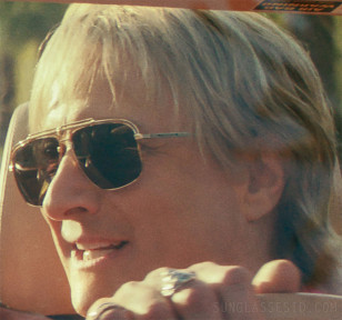 Bronson Pinchot wears gold Versace VE2242 sunglasses in Beverly Hills Cop: Axel F.