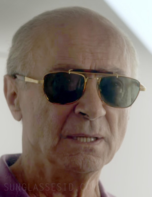 Salim Daw as Mohammed Al Fayed wears 1990s Sting sunglasses in Season 6 of the Netflix series The Crown (2023).