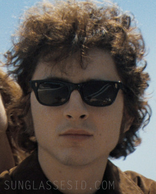 Timothée Chalamet as Bob Dylan wears vintage black Bausch & Lomb sunglasses in A Complete Unknown (2024).