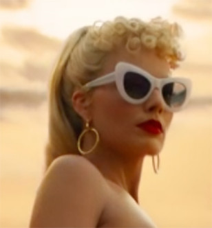Margot Robbie wears white cat-eye sunglasses in the movie Barbie.
